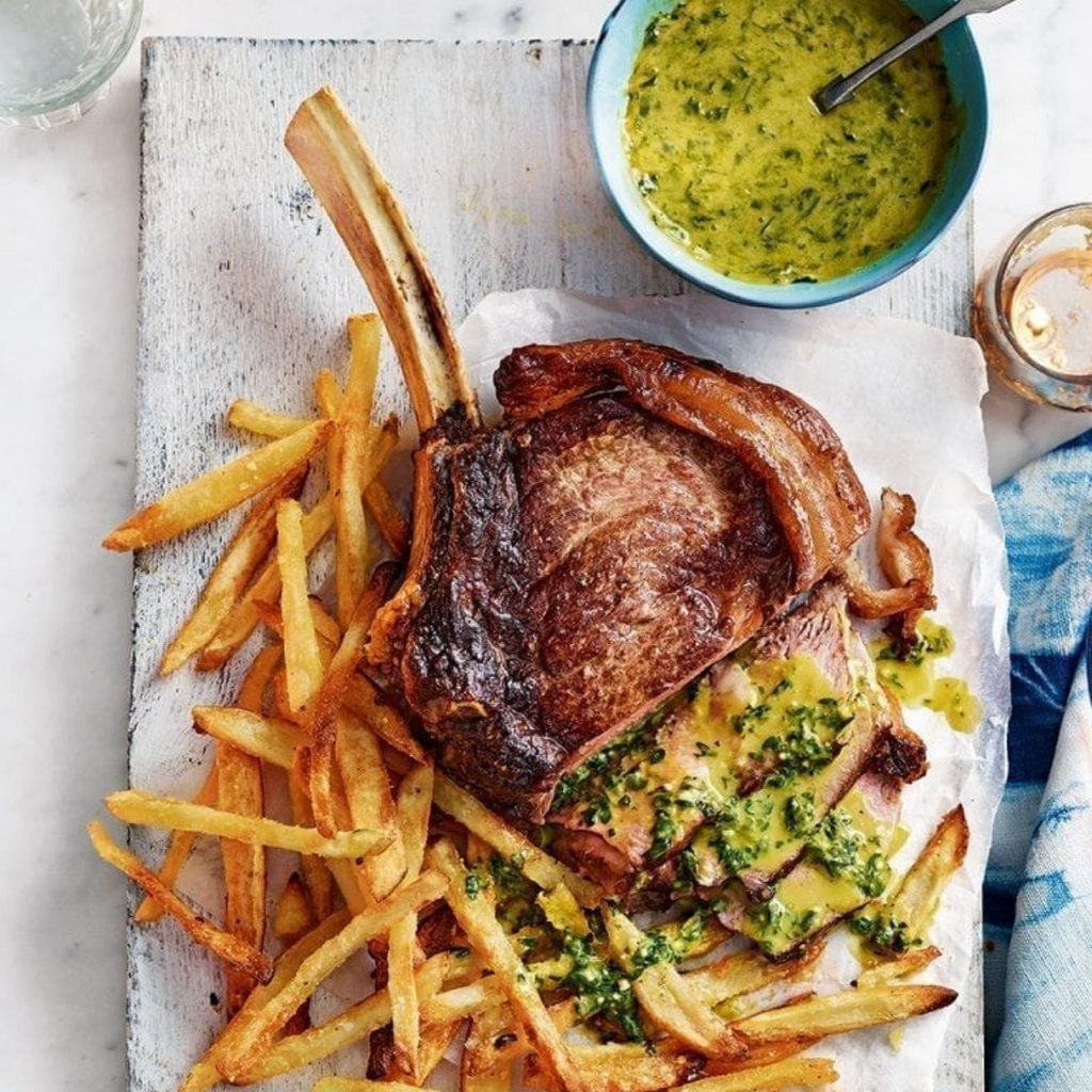 Rib Eye steak with pesto hollandaise and skinny oven chips